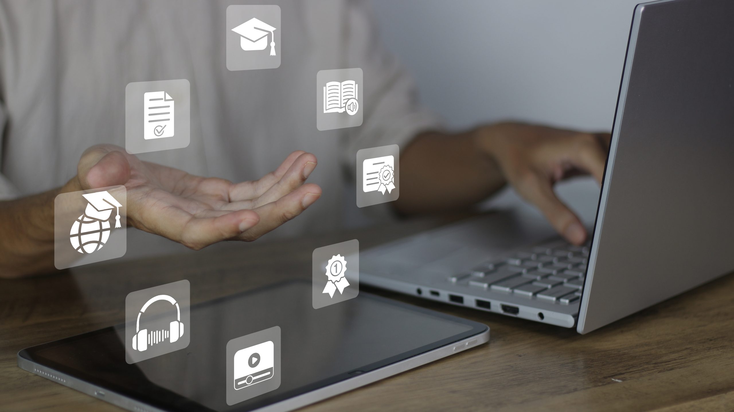 Student at computer with various edtech icons